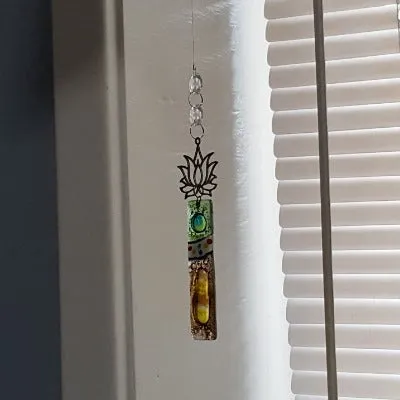 Brown and green fused glass lotus flower ornament.