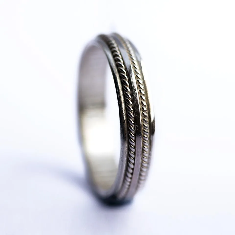 Double twist- commitment rings